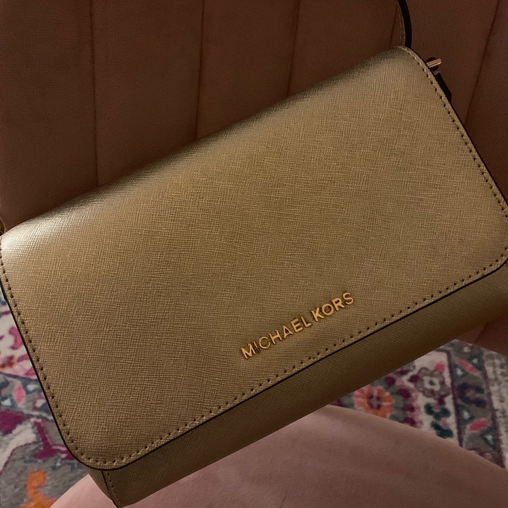 Michael Kors gold clutch.